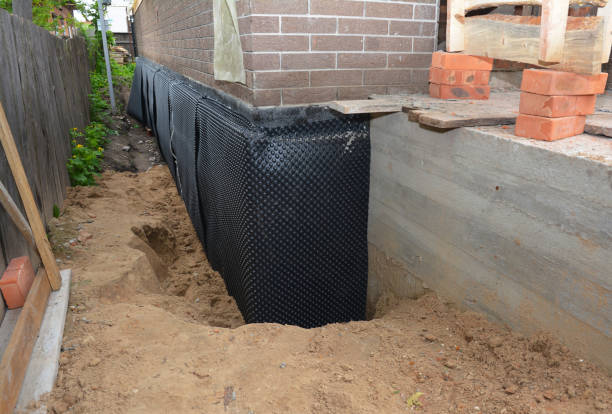 Happy homeowners after waterproofing job in Winnebago